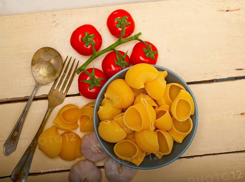 Italian snail lumaconi pasta with ripe cherry tomatoes sauce ingredients