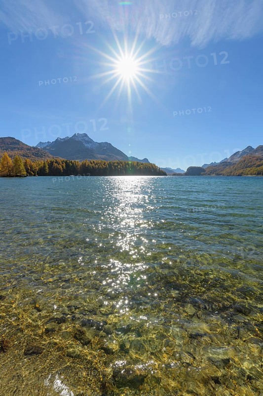Lake Silsersee with sun in autumn