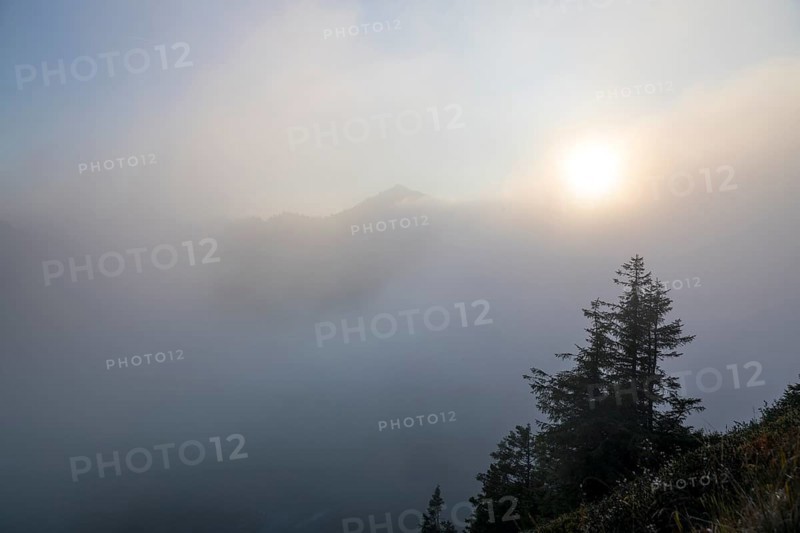 Fog in the high valley on an autumn evening at Potlakopf