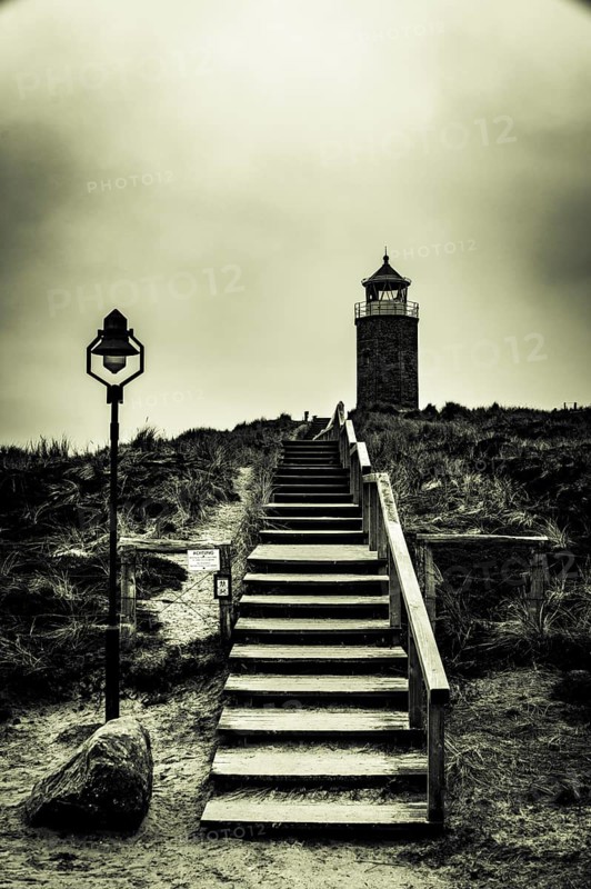 Cross light red cliff with wooden stairs