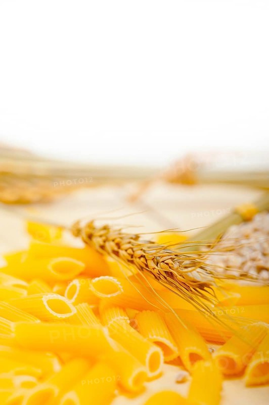 Short Italian pasta penne with durum wheat grains