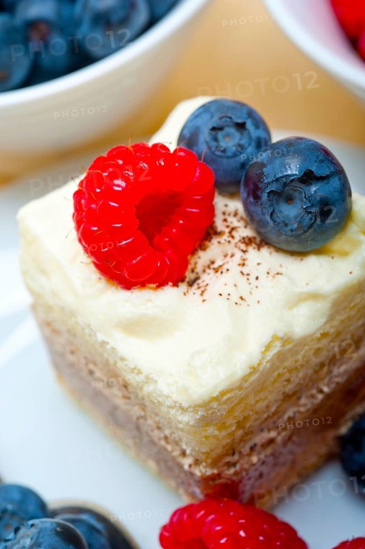 Fresh homemade raspberry and blueberry cream cake