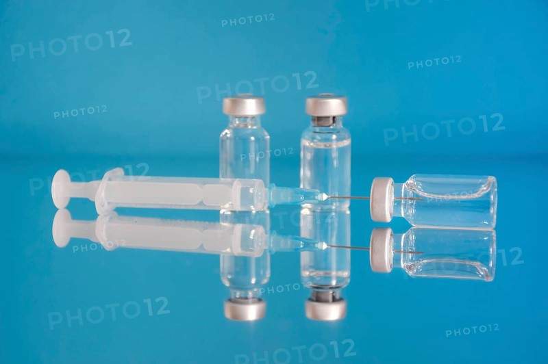 Vaccine bottles and syringe