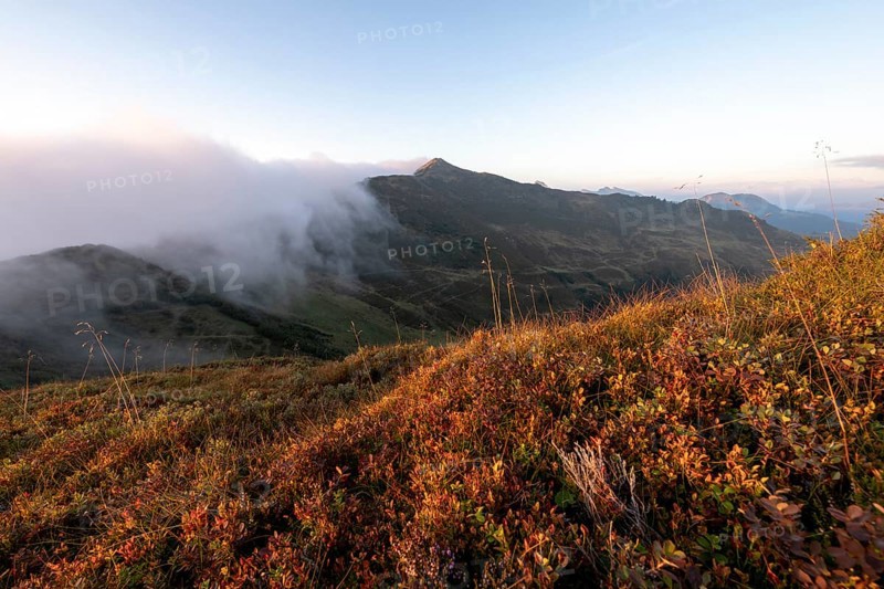 Fog in the high valley on an autumn evening at Potlakopf