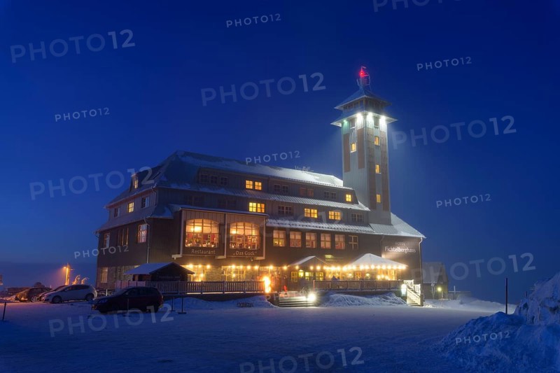 Fichtelberghaus on the summit of Fichtelberg at dusk in winter