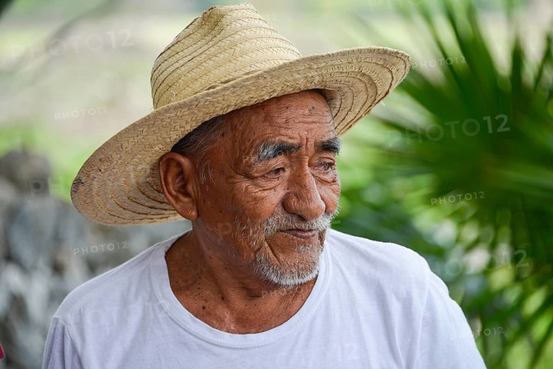 Old farmer explaining the production of sisal