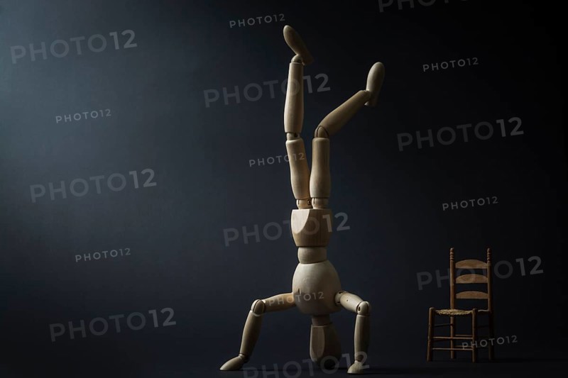 The mannequin is standing on its head