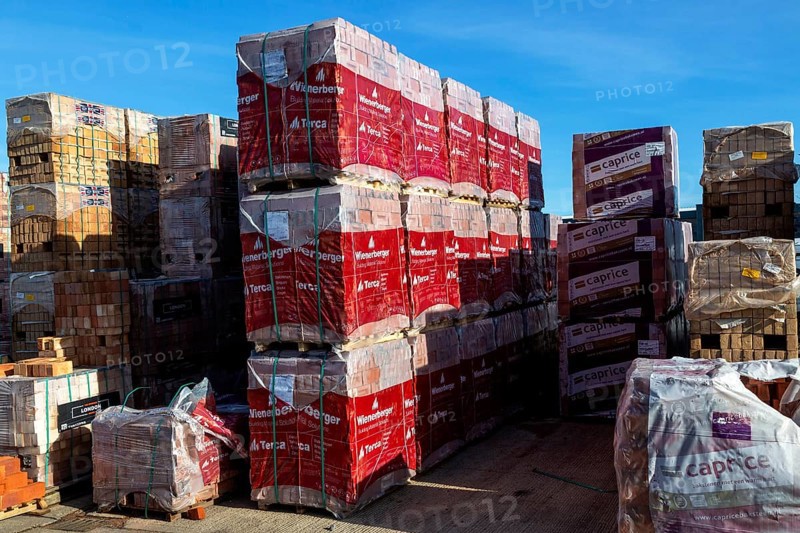 Piles of bricks in Jewson builders merchant yard