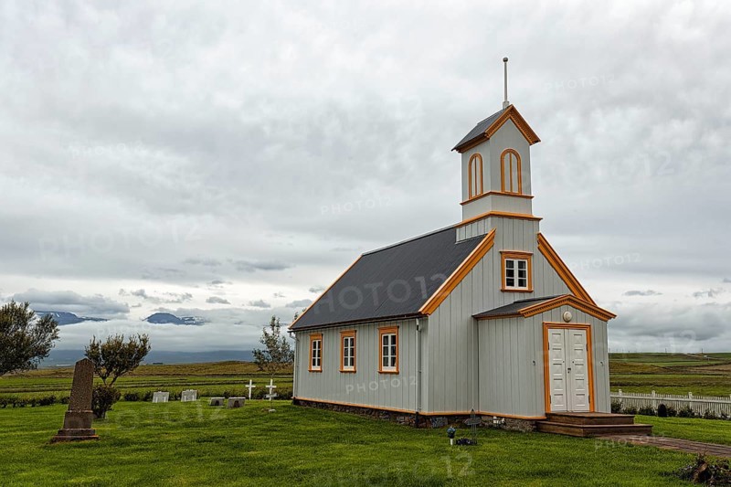 Small wooden church with cemetery