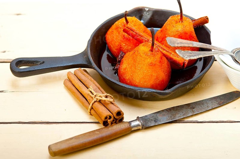 Poached pears delicious home made recipe ove white rustic wood table