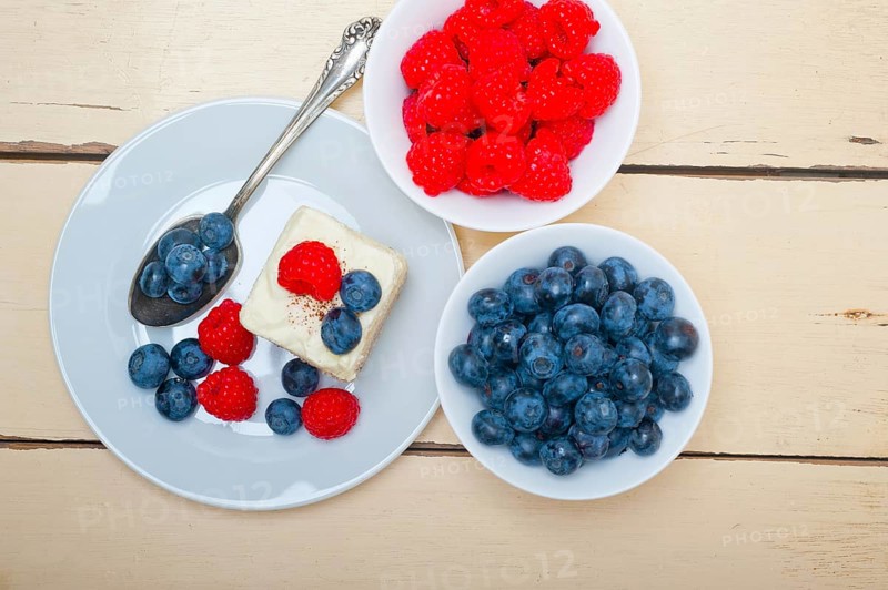 Fresh homemade raspberry and blueberry cream cake