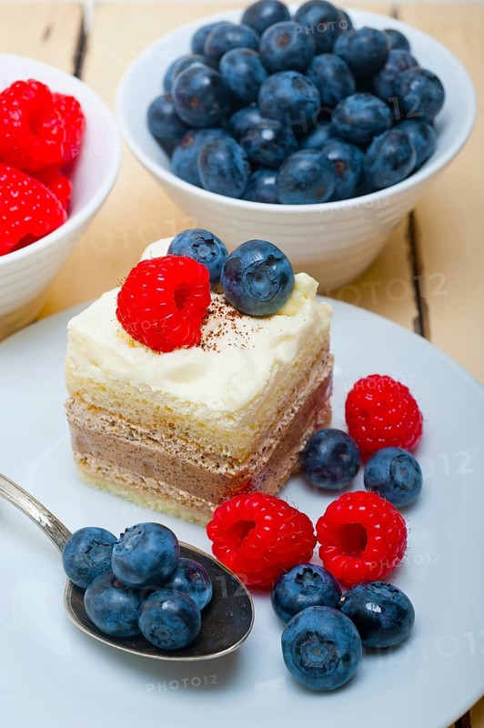 Fresh homemade raspberry and blueberry cream cake