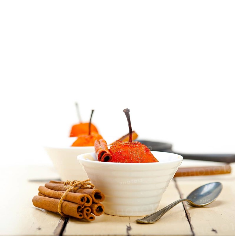 Poached pears delicious home made recipe ove white rustic wood table