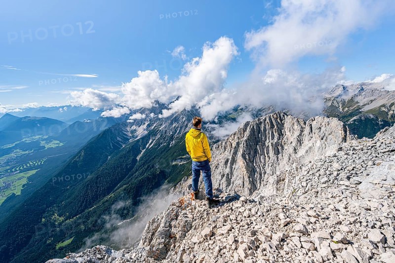 Hiker on the west summit of Hohe Munde