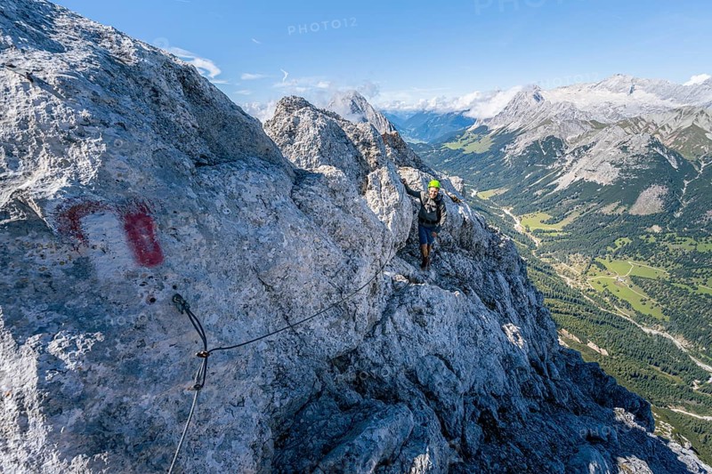 Climbers on the via ferrata on the ridge of Hohe Munde