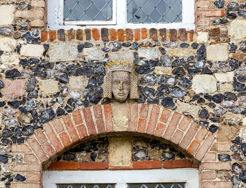 Carved face and head of Tudor figure