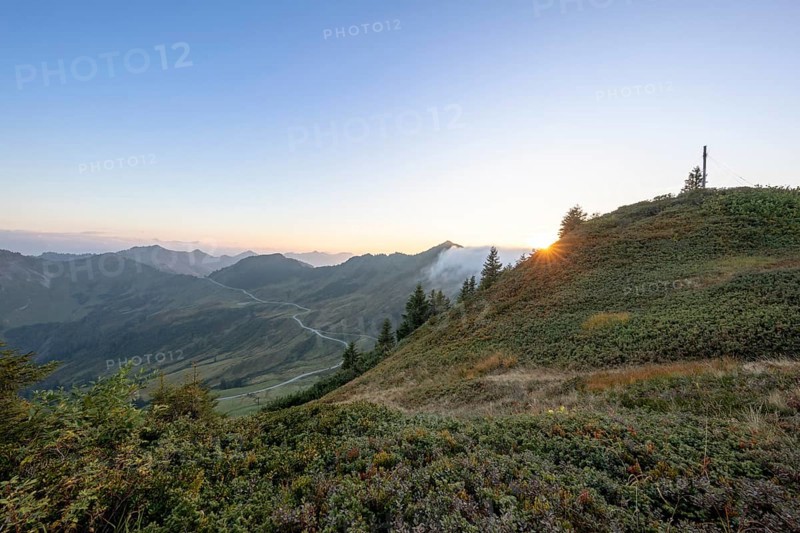 Summit cross in the morning light on Portlakopf