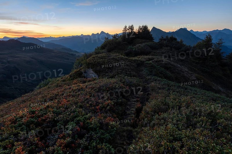 Mountain panorama in front of sunrise from Portlakopf