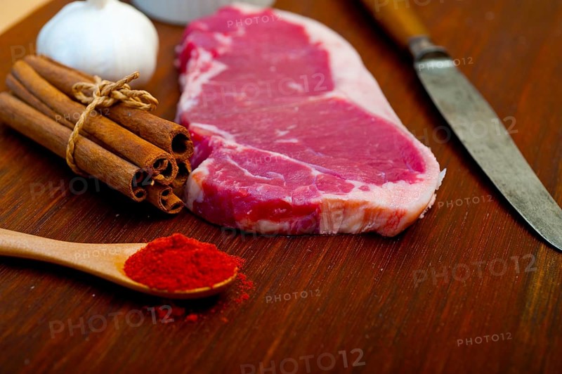 Raw uncooked ribeye beef steak butcher selection