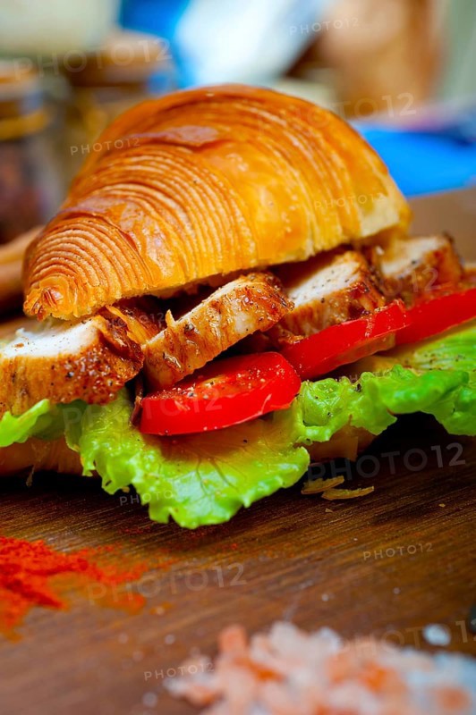 Savory croissant brioche bread with chicken breast and vegetable rustic style