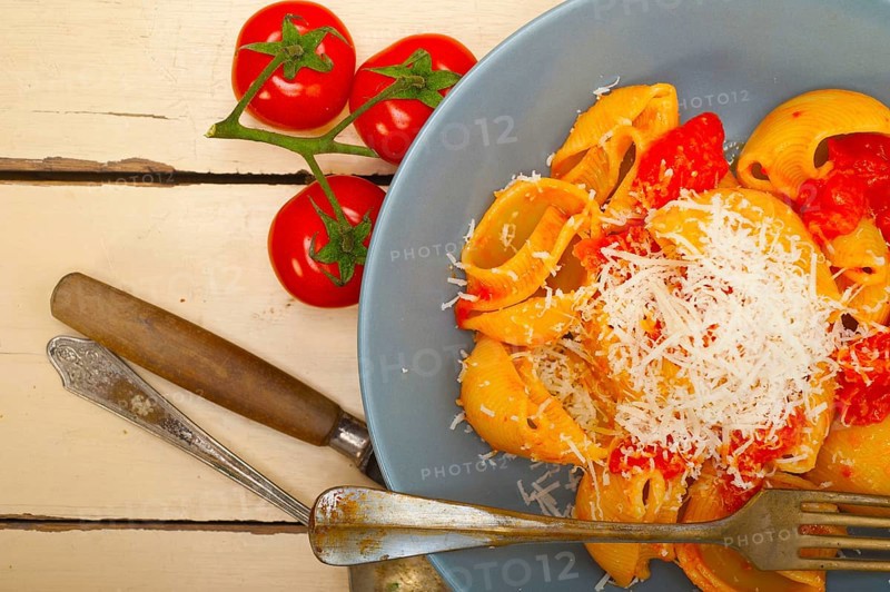 Italian snail lumaconi pasta with ripe cherry tomatoes sauce ingredients