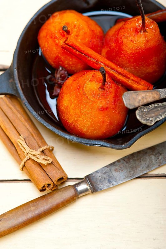 Poached pears delicious home made recipe ove white rustic wood table