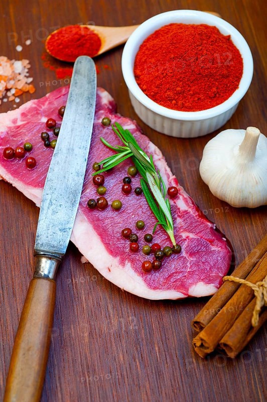 Raw uncooked ribeye beef steak butcher selection
