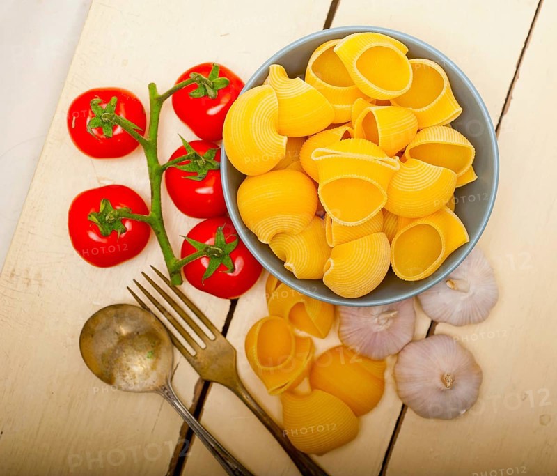 Italian snail lumaconi pasta with ripe cherry tomatoes sauce ingredients