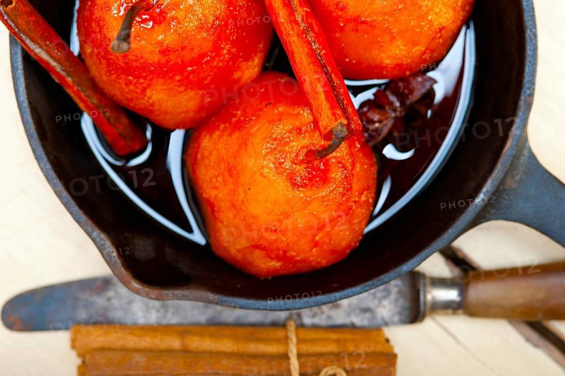 Poached pears delicious home made recipe ove white rustic wood table