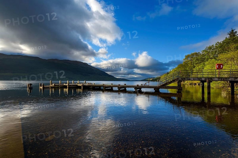 Wooden jetty on lake at morning