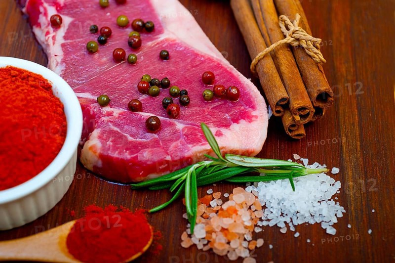 Raw uncooked ribeye beef steak butcher selection