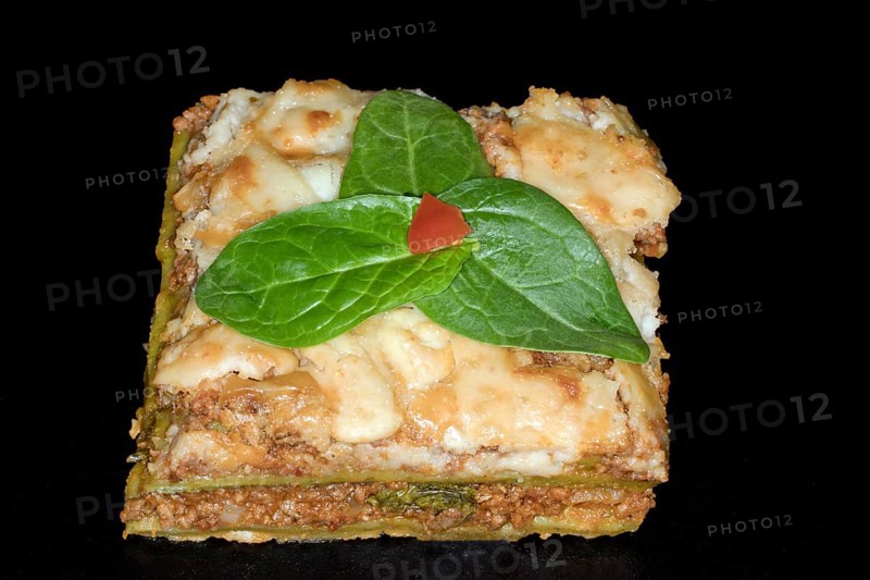 Classic lasagne with spinach leaves