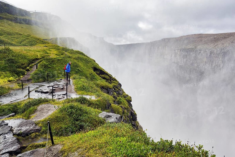 Hiker at the edge of Dettifoss