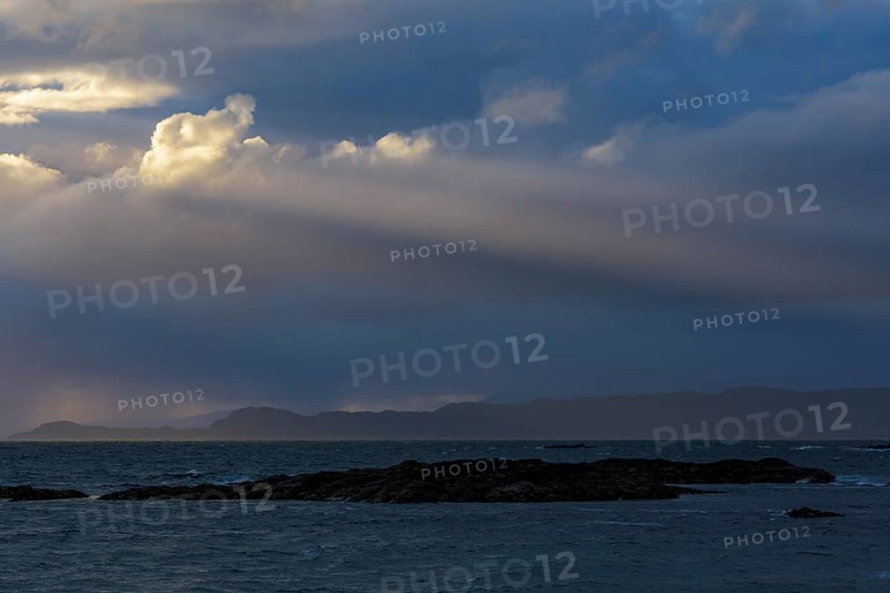 Scottish coast at sunset with sunrays