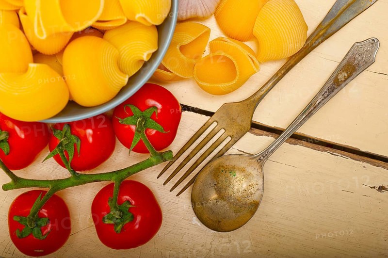 Italian snail lumaconi pasta with ripe cherry tomatoes sauce ingredients