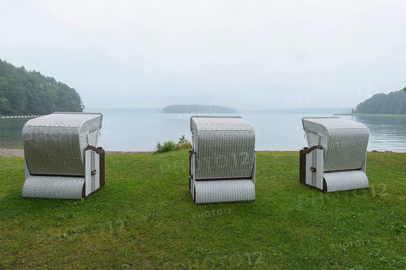 Lakeshore with beach chairs in the morning