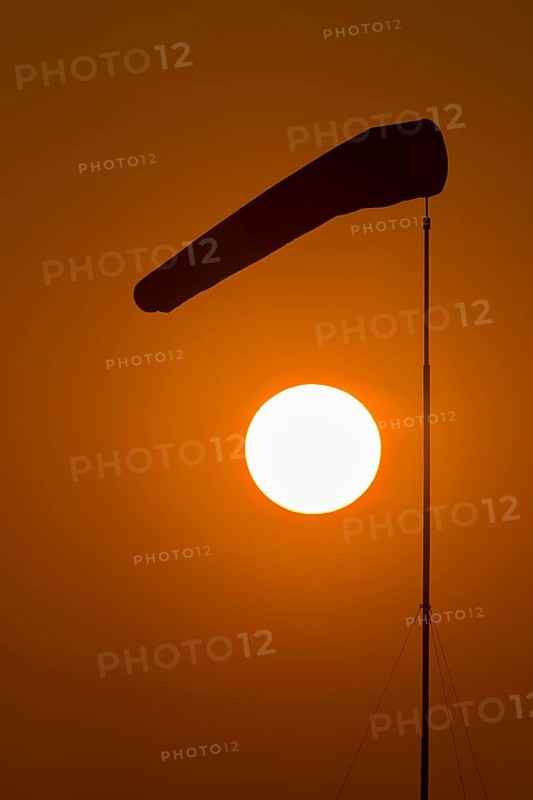 Evening sun with windsock