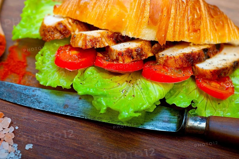 Savory croissant brioche bread with chicken breast and vegetable rustic style