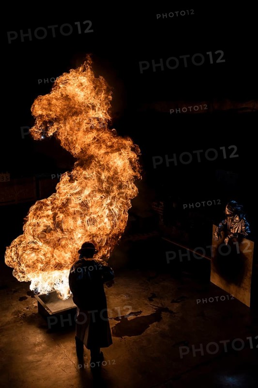 Firefighter extinguishes a heptane 2B-Pan fire with a 2-BTP extinguisher