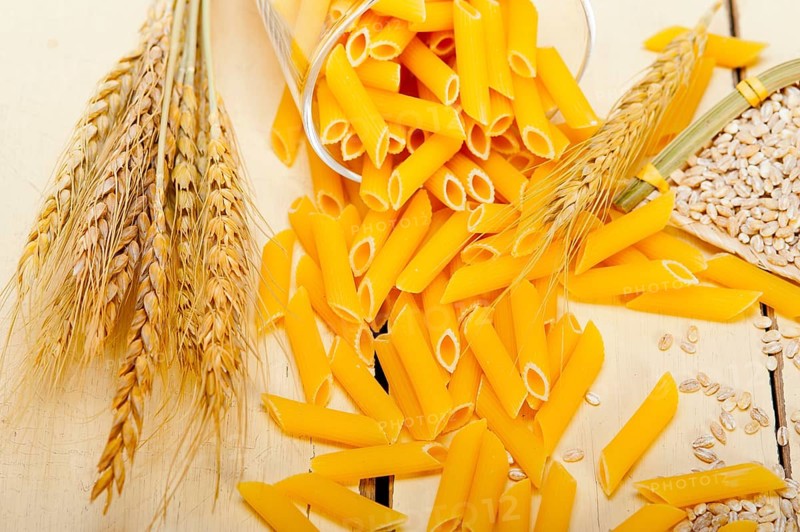 Short Italian pasta penne with durum wheat grains
