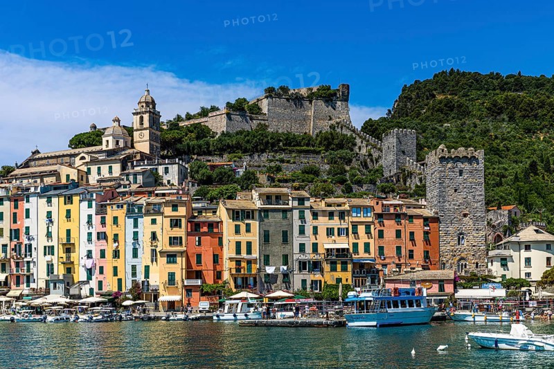 Pastel-coloured house facades in the harbour of Portovenere