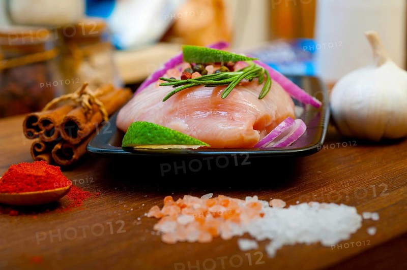 Fresh organic chicken breast with herbs and spices