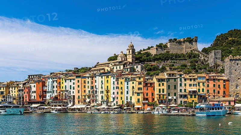 Pastel-coloured house facades in the harbour of Portovenere