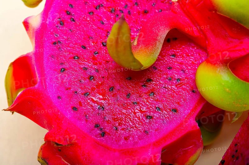 Fresh thai purple dragon fruit over white rustic table
