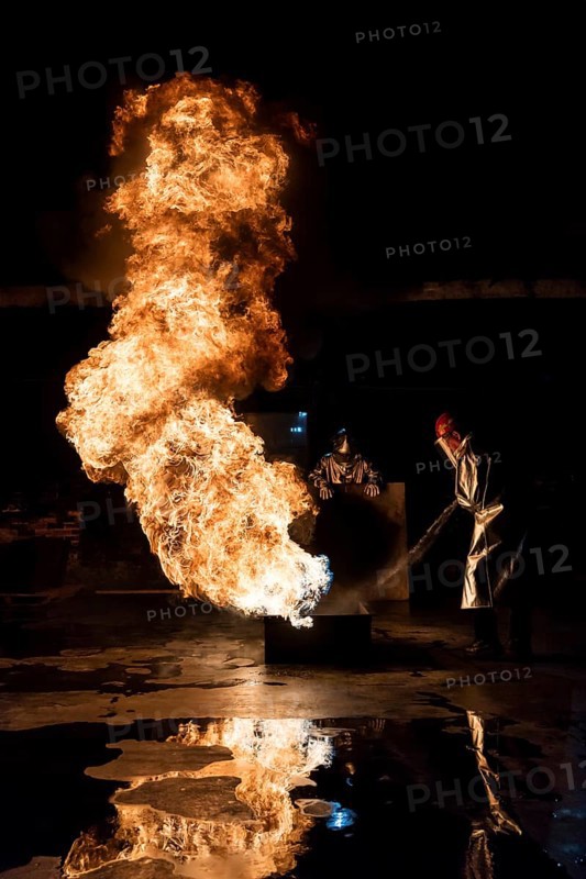 Firefighter extinguishes a heptane 2B-Pan fire with a 2-BTP extinguisher
