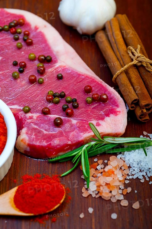 Raw uncooked ribeye beef steak butcher selection