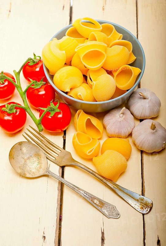 Italian snail lumaconi pasta with ripe cherry tomatoes sauce ingredients