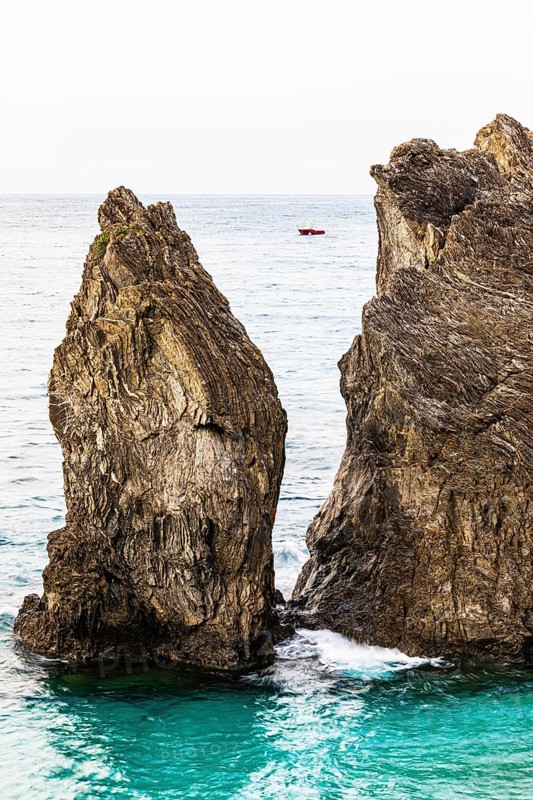 Boulders in the turquoise green sea