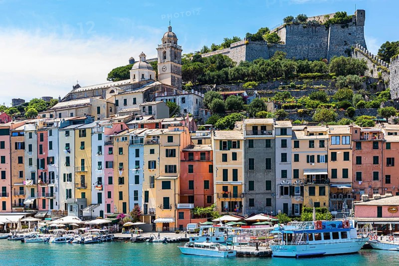 Pastel-coloured house facades in the harbour of Portovenere