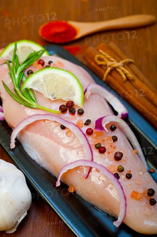 Fresh organic chicken breast with herbs and spices